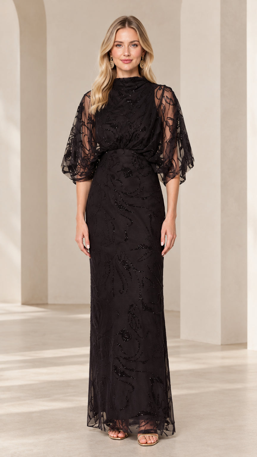 Front view of woman wearing black high-neck beaded maxi evening gown with draped flutter sleeves