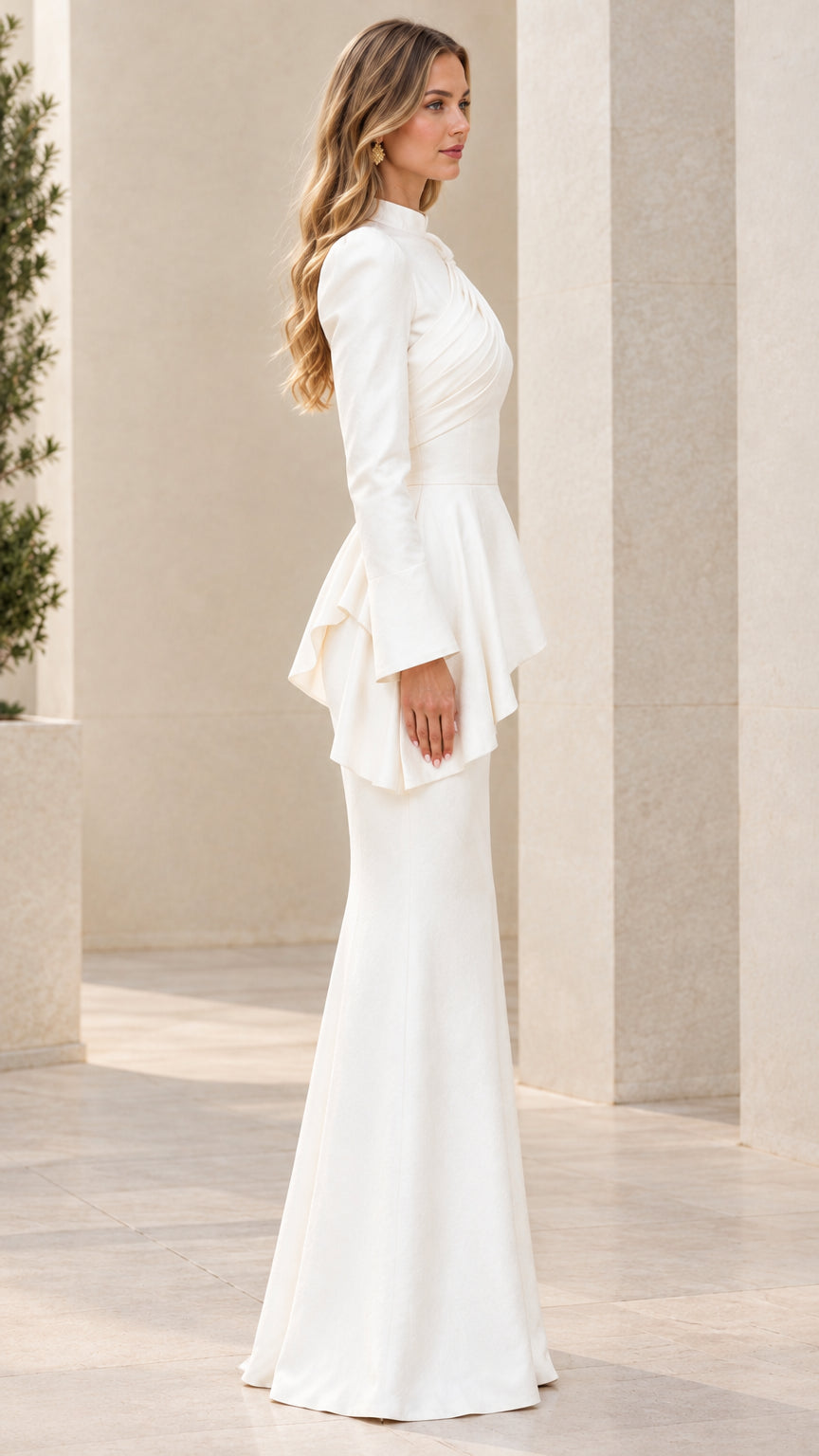 Side profile view of white long sleeve mermaid formal dress
