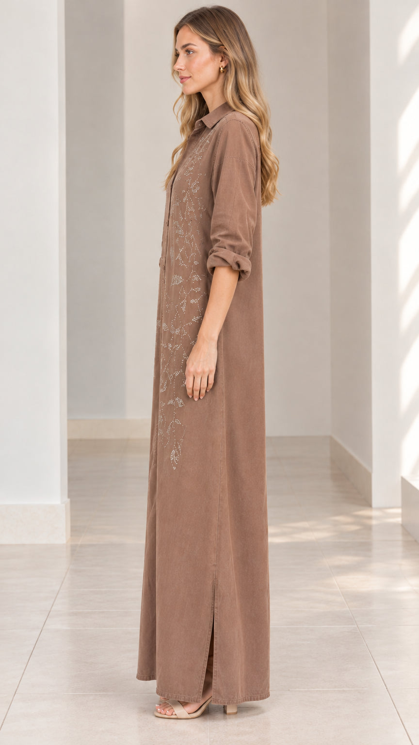 Side profile view of woman wearing mocha brown embroidered maxi shirt dress