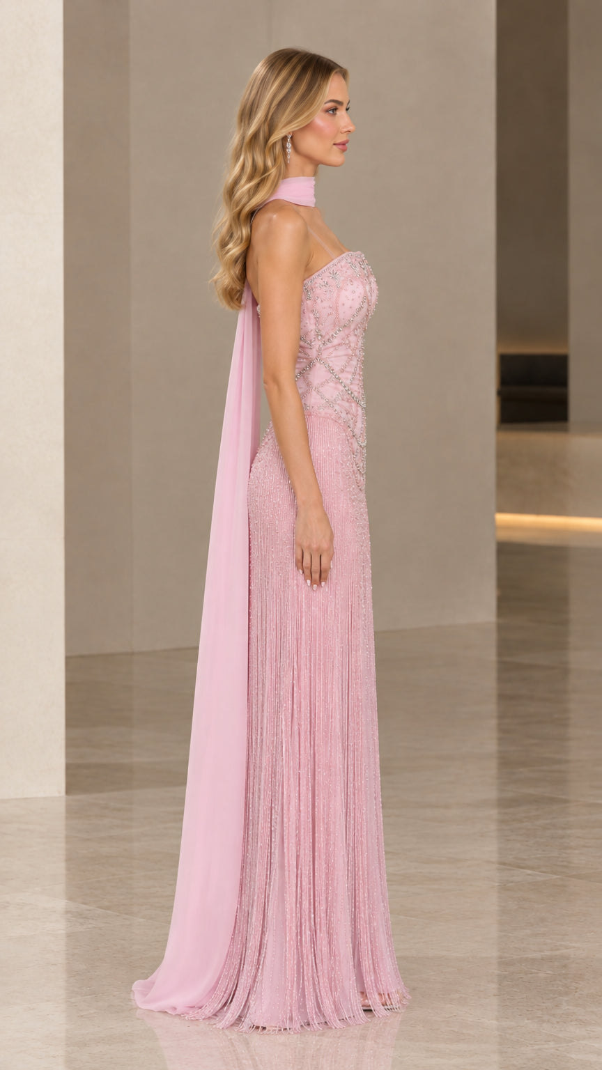 Side profile view of Blush Pink beaded fringe formal gown with cape