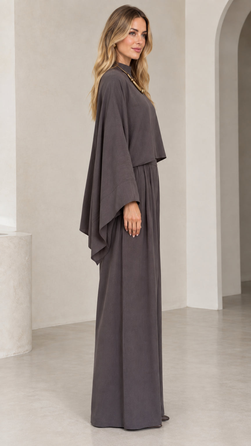 Side profile view of woman wearing charcoal grey flowing wide leg two-piece set