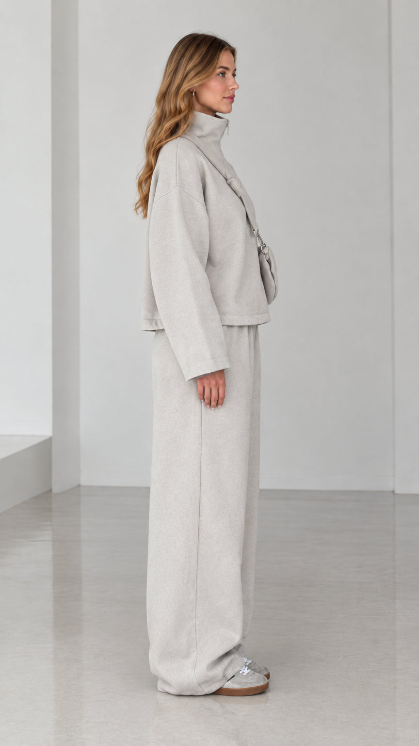 Side profile of model wearing Light Gray fleece two-piece wide-leg lounge set