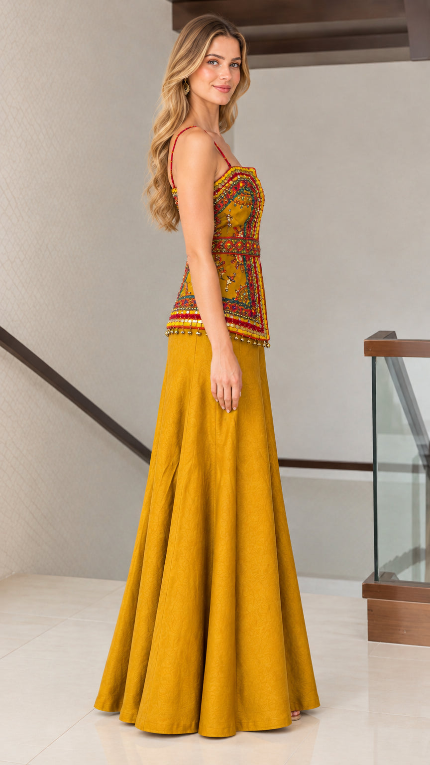 Side profile of woman wearing mustard yellow embroidered two-piece wide-leg set