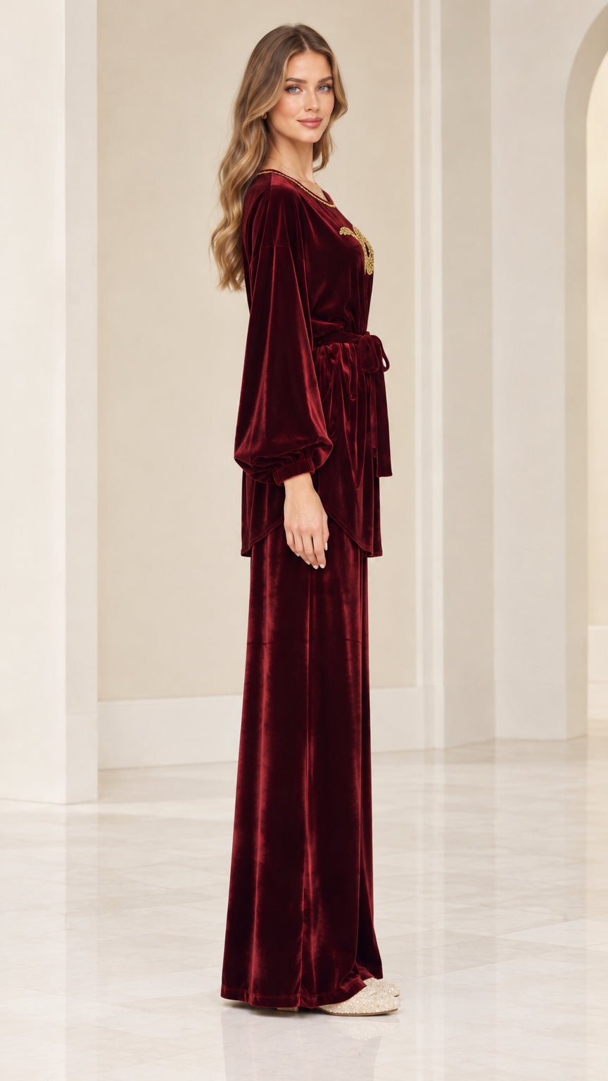 Side profile of burgundy velvet matching two piece set with tie belt