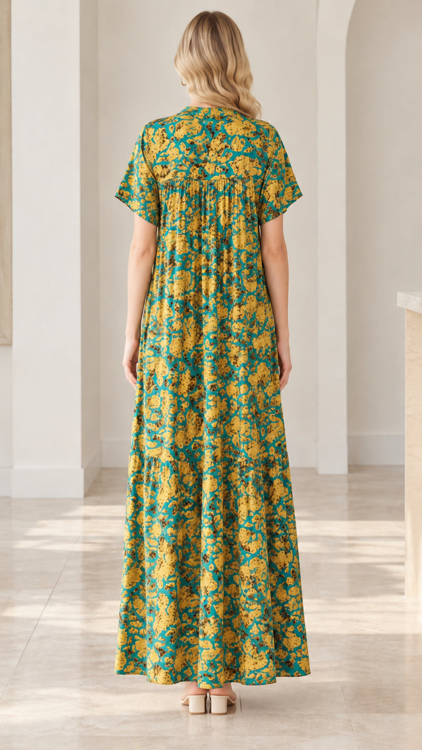 Back full-length view of teal floral maxi dress with gathered back yoke