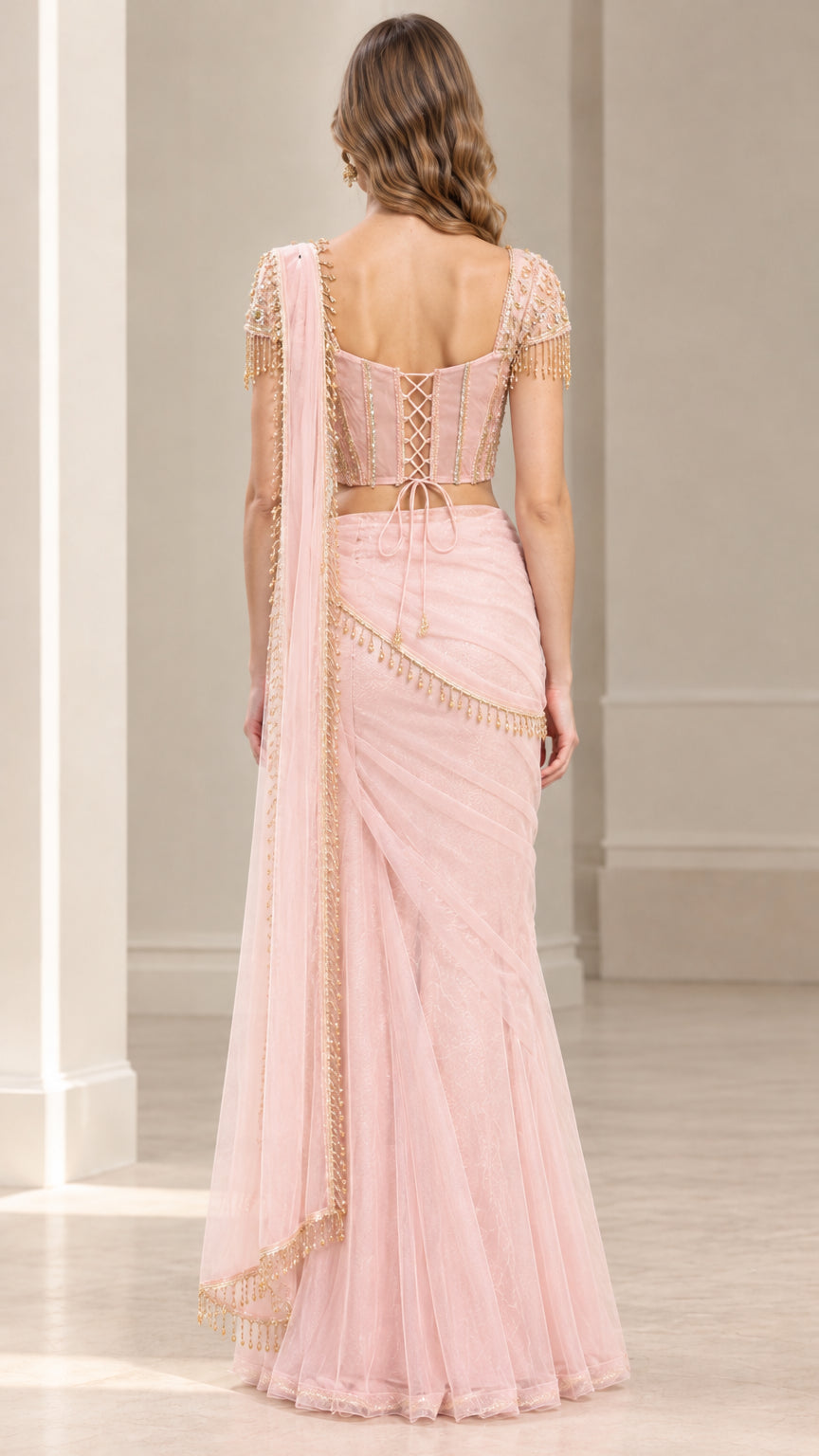 Back view of blush pink saree set showing lace-up corset detail