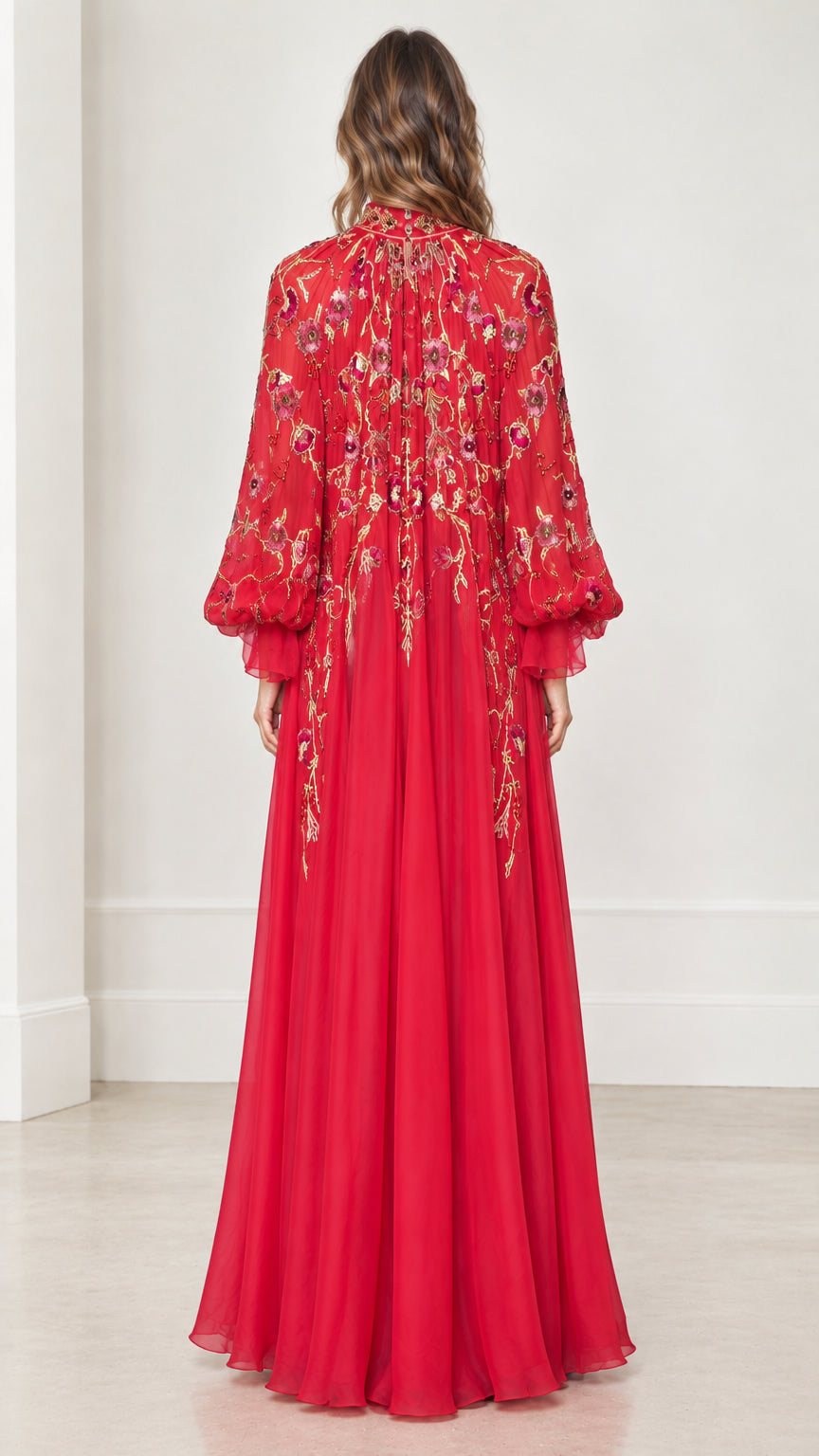Back full-length view highlighting the floor-sweeping red sheer embroidered cape