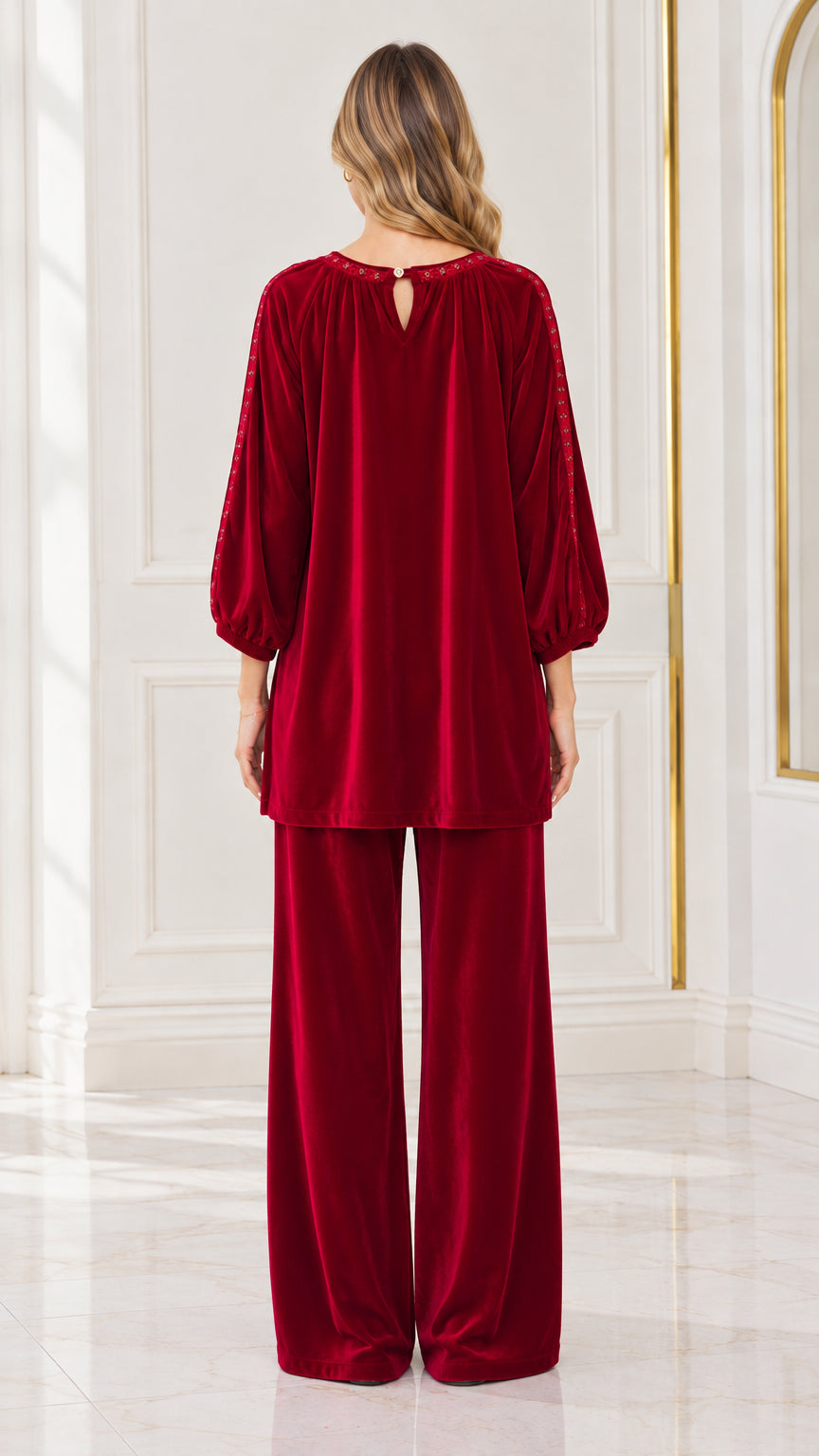 Back view of woman wearing Wine Red velvet tunic top and pants set with back keyhole