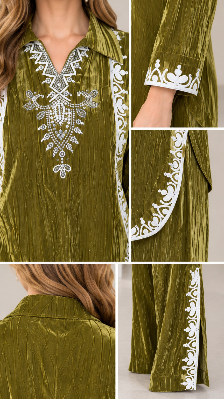 Close-up details of embroidery on neckline, cuffs, tunic hem, and pant leg