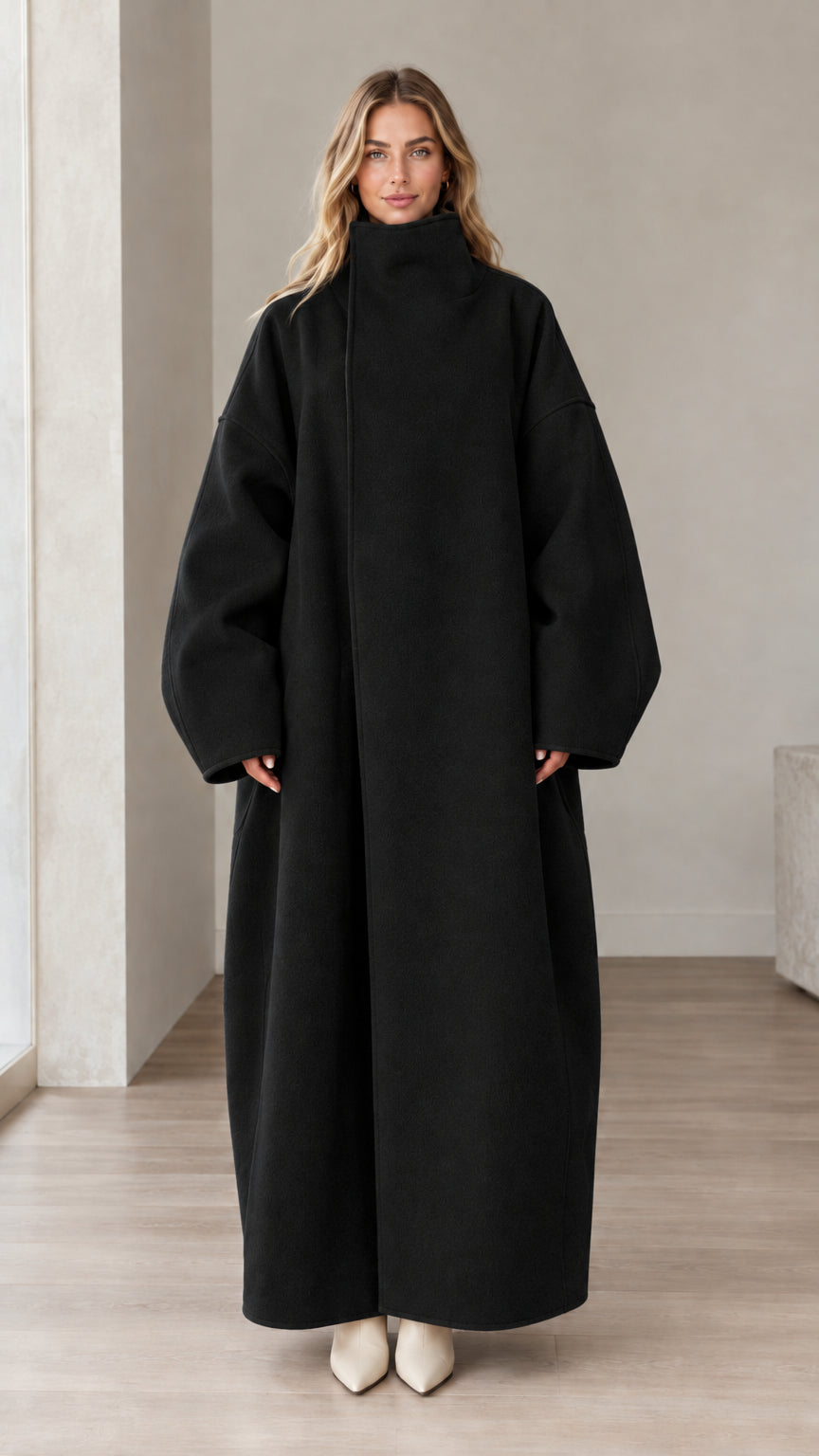Front full view of woman wearing Black high neck oversized maxi coat