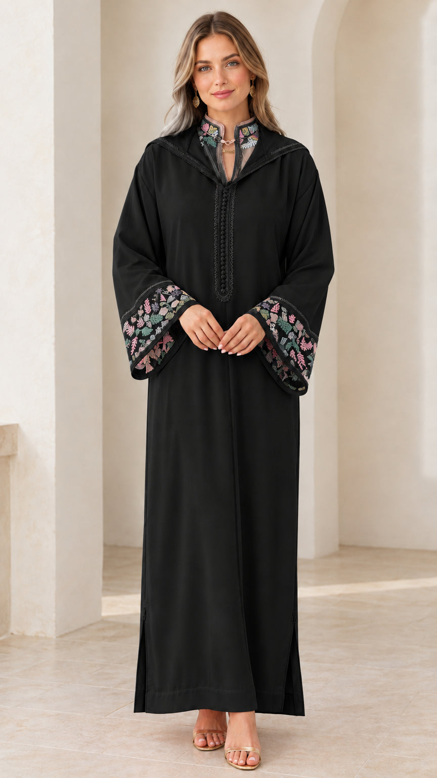 Model wearing black embroidered hooded djellaba maxi dress