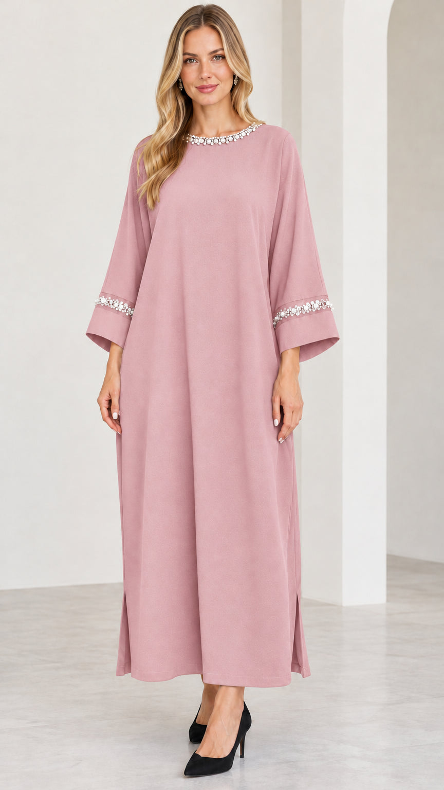 Full-length view of dusty pink pearl-embellished kaftan maxi dress