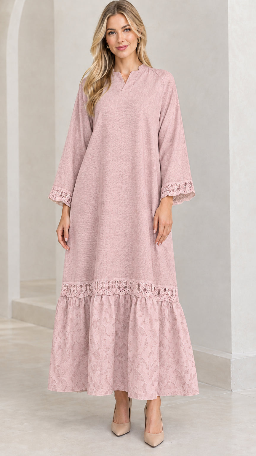 Front view of woman wearing dusty pink lace-trimmed tiered maxi dress