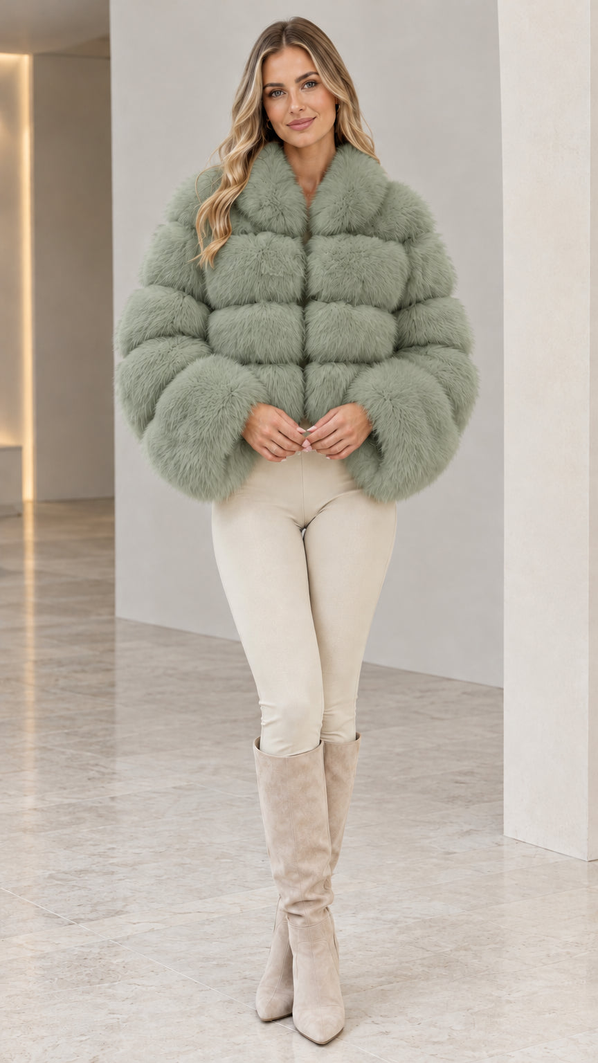 Model wearing sage green cropped tiered faux fur jacket