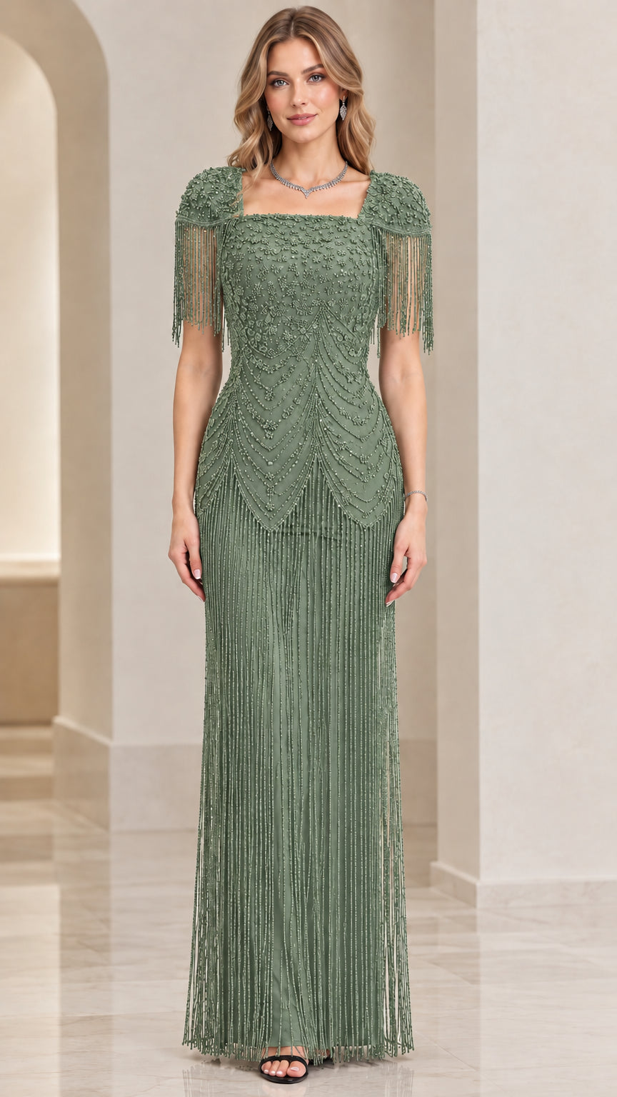 Front view of sage green beaded formal evening gown with fringe skirt