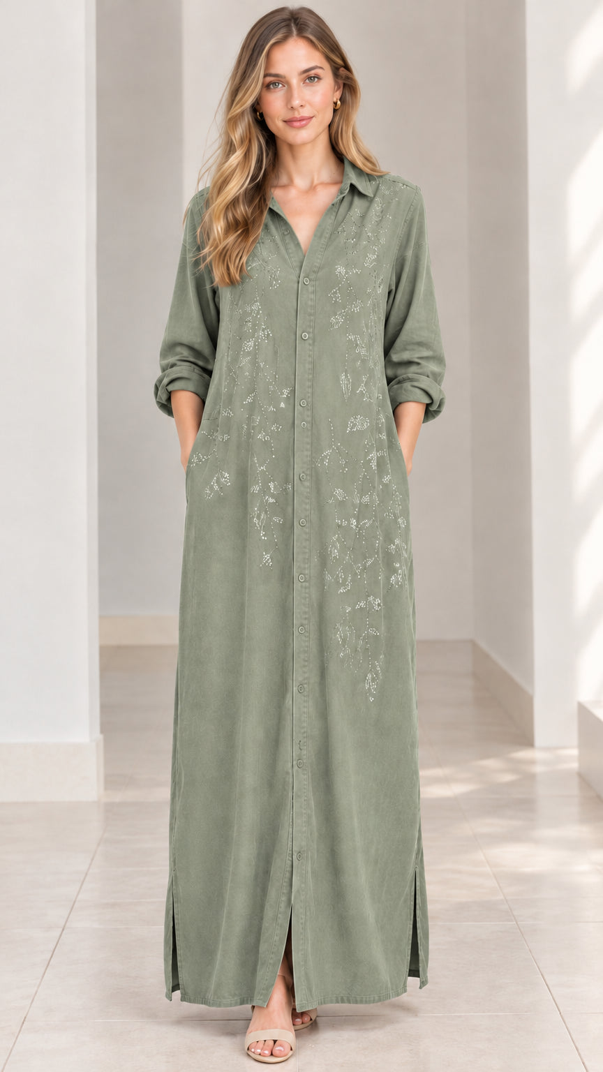 Front view of woman wearing sage green embroidered maxi shirt dress