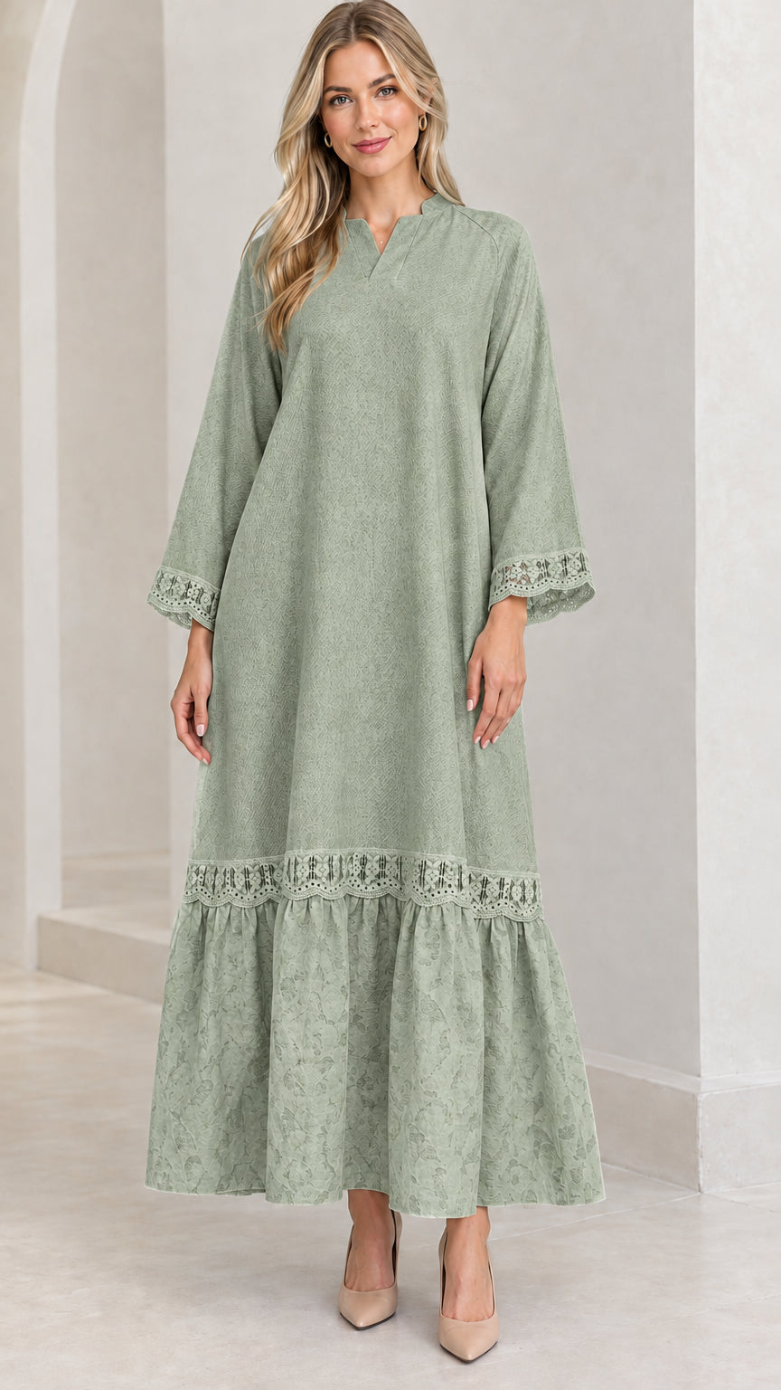 Front view of woman wearing sage green lace-trimmed tiered maxi dress
