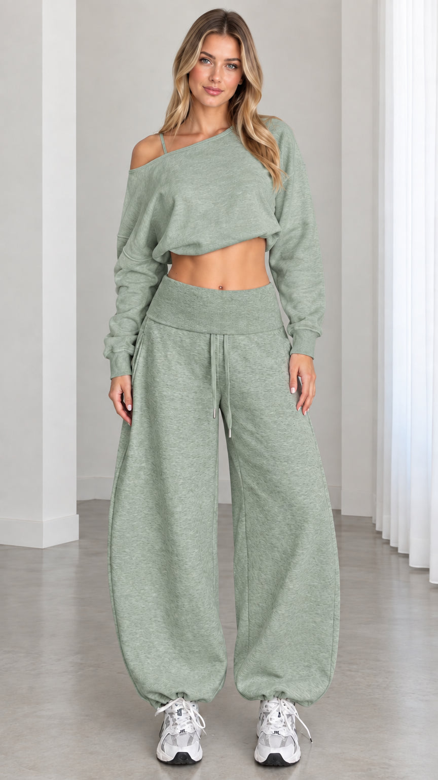Model wearing sage green 2-piece off-shoulder crop top and matching balloon jogger sweatpants