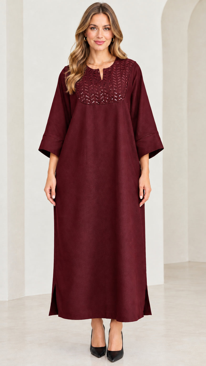 Front view of woman wearing burgundy wine red sequin kaftan maxi dress