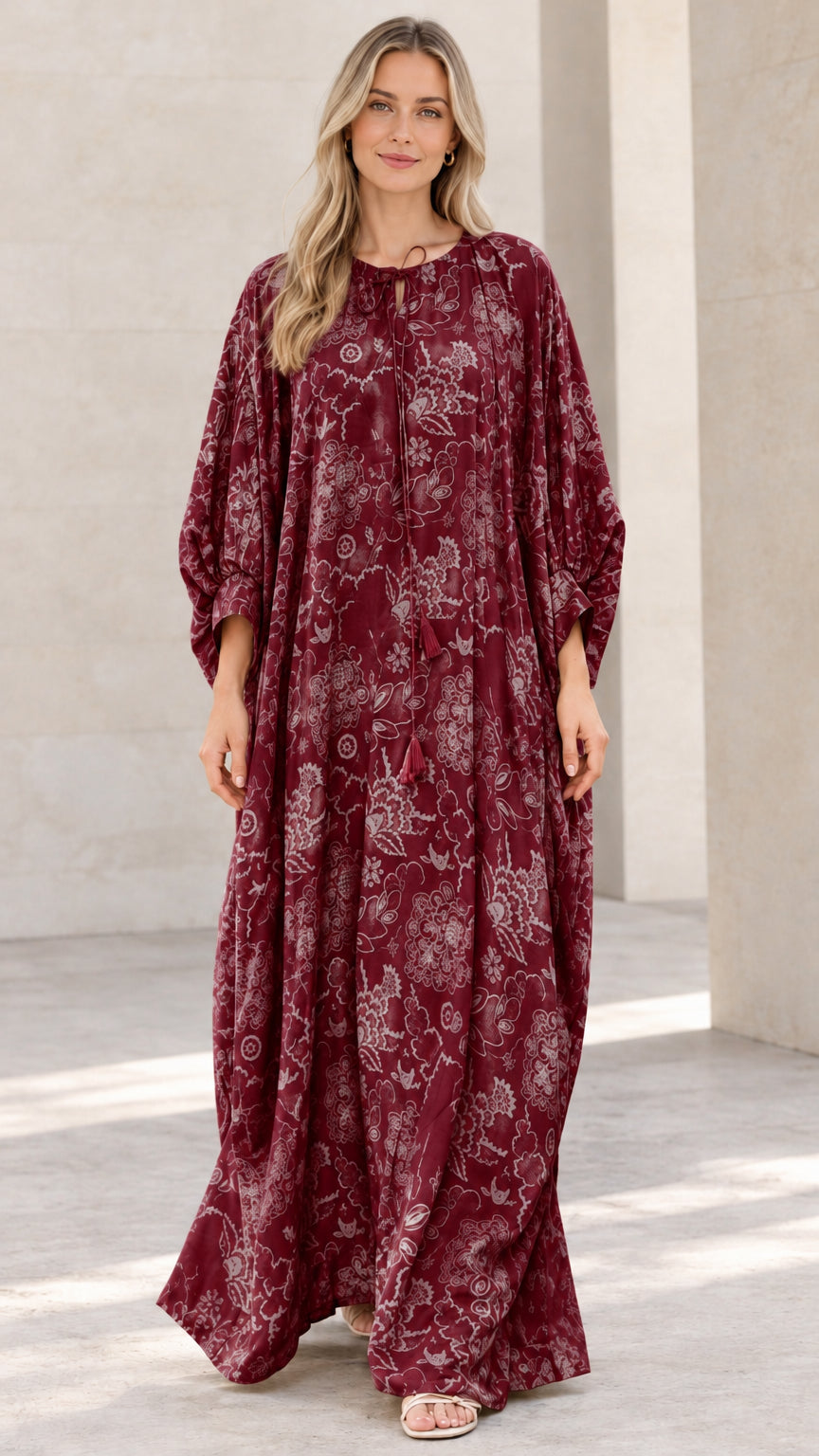 Front view of woman wearing burgundy wine floral print caftan maxi dress
