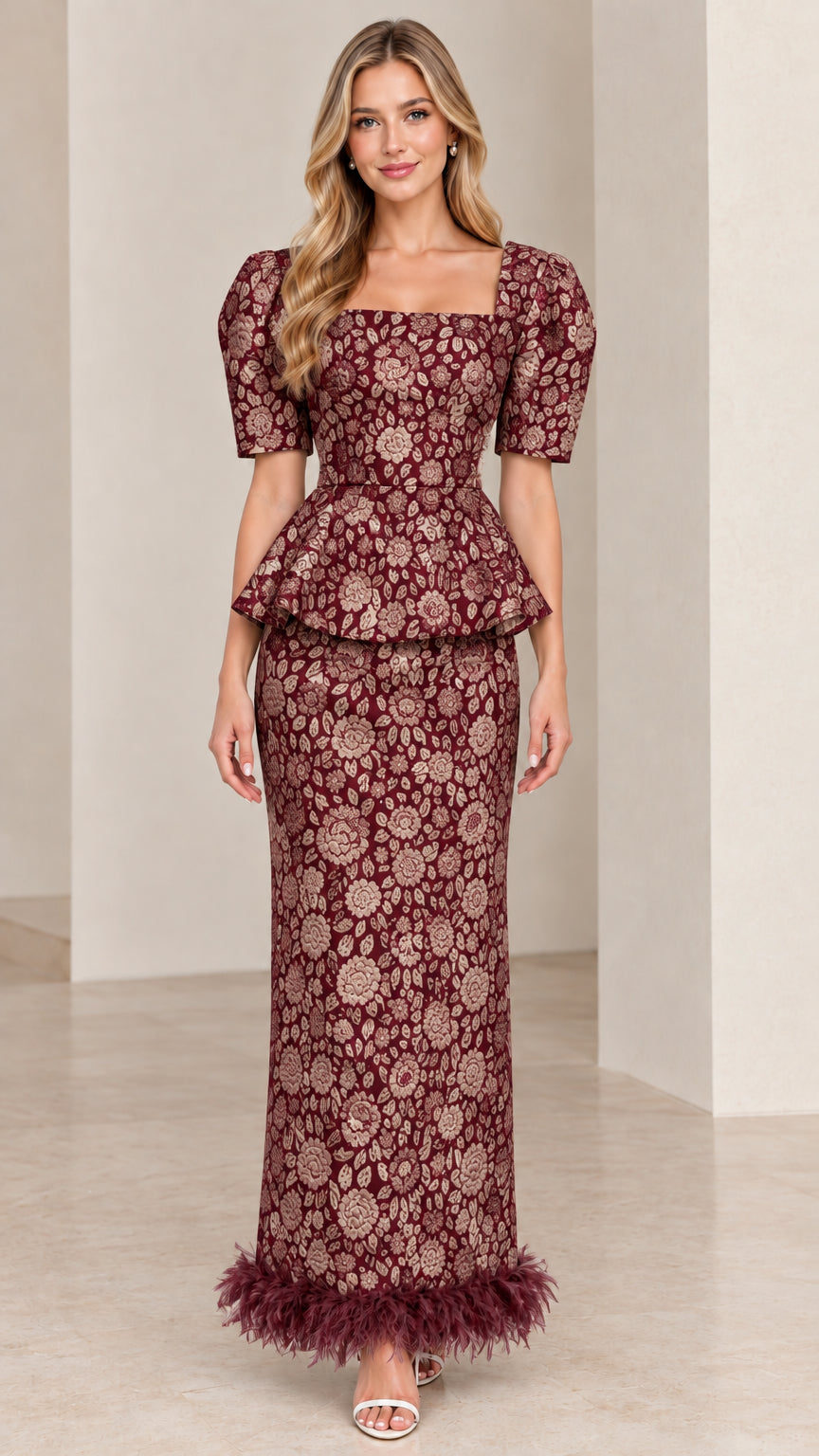 Front view of Burgundy floral jacquard peplum formal dress with feather trim