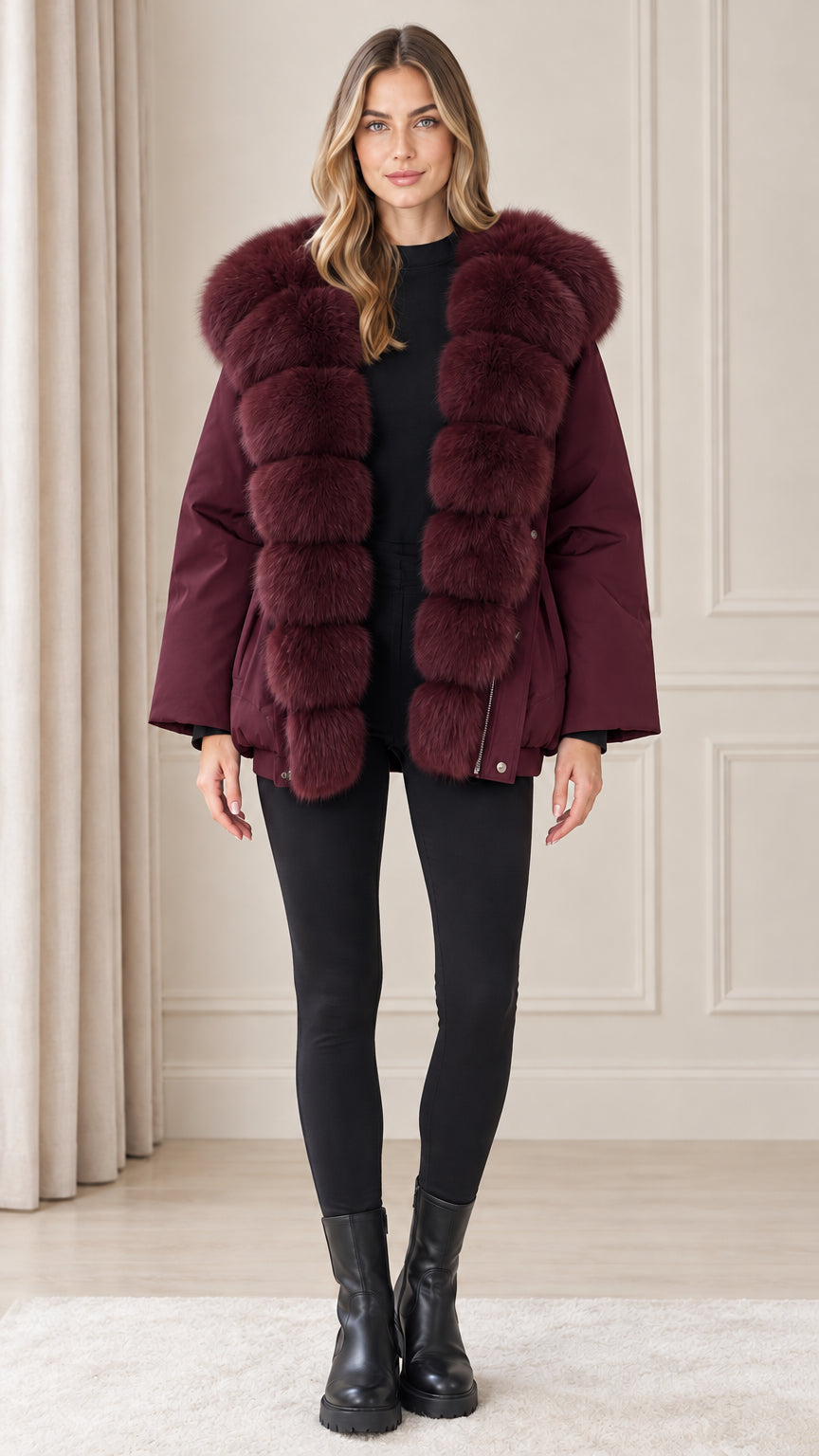 Front view of model wearing burgundy wine red plush trim hooded parka coat