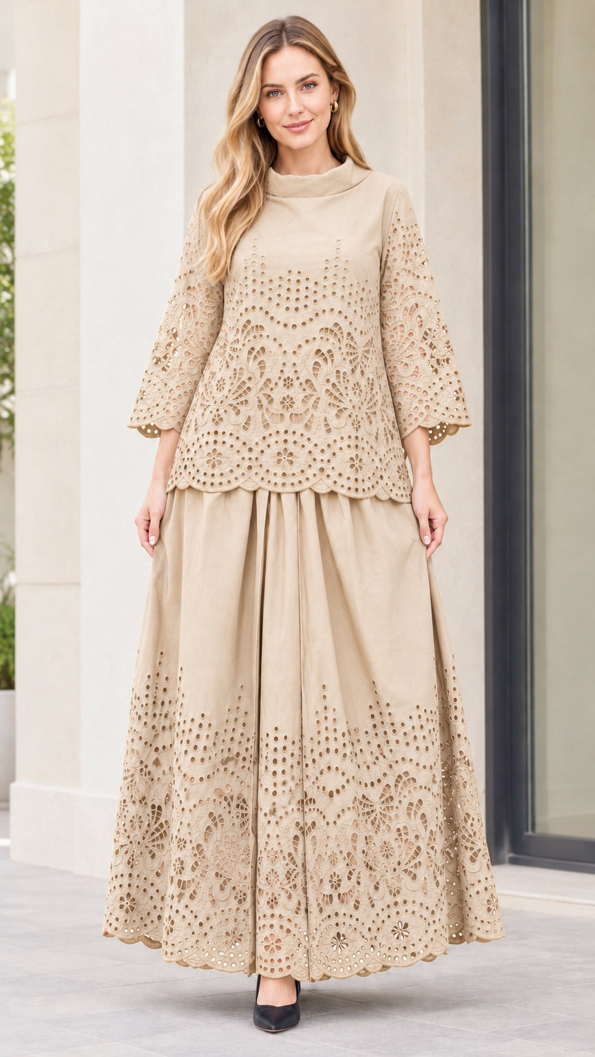 Front view of woman wearing beige eyelet embroidered top and maxi skirt two-piece set