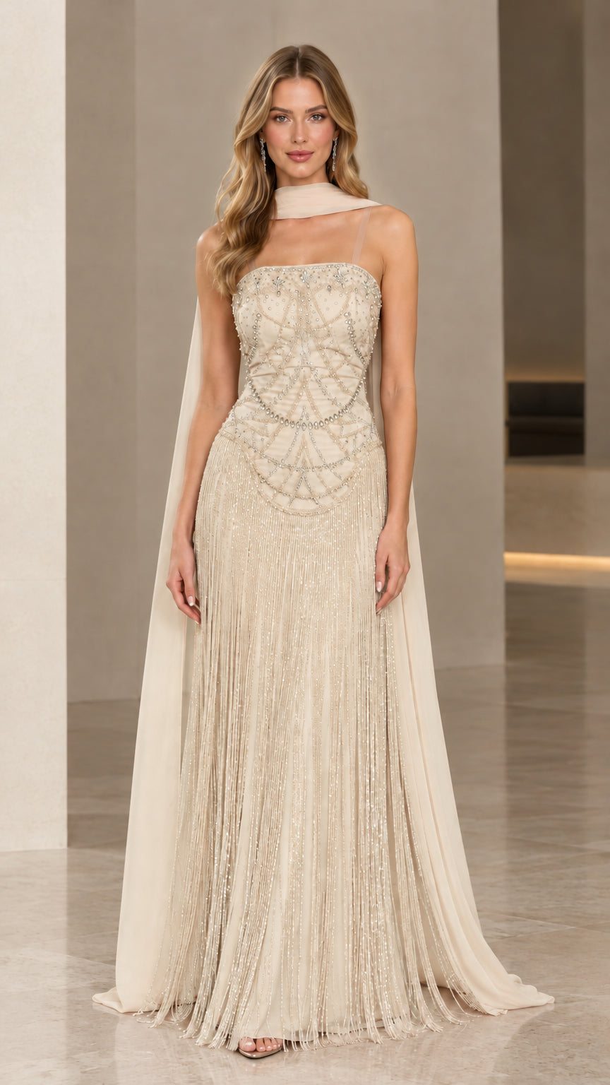 Front view of Champagne cream beaded fringe maxi evening gown with cape