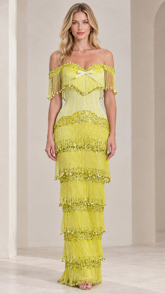 Front view of model wearing lime green off-shoulder tiered fringe sequin maxi dress