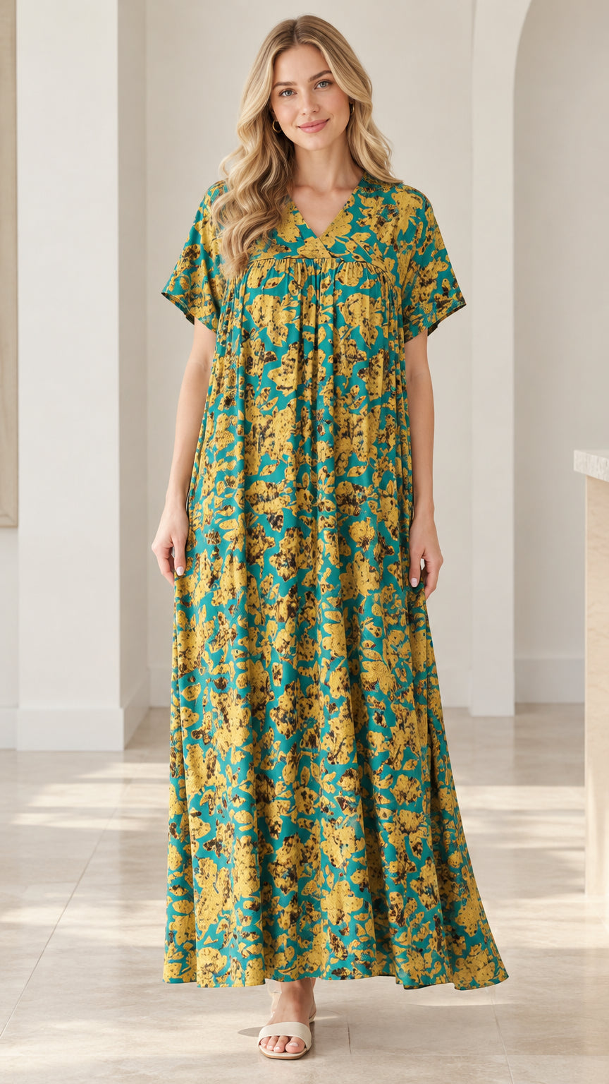 Front full-length view of model wearing teal floral V-neck short sleeve maxi dress
