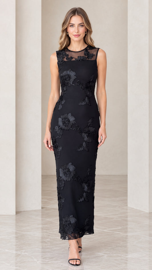 Front view of model wearing black floral appliqué sleeveless column maxi dress
