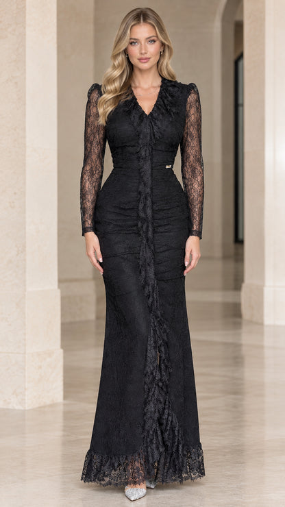 Front full-length view of woman wearing Black lace maxi gown with long sleeves and ruffle detail