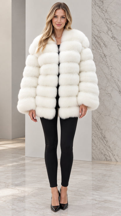 Front view of model wearing white striped plush faux fur coat with black pants and heels