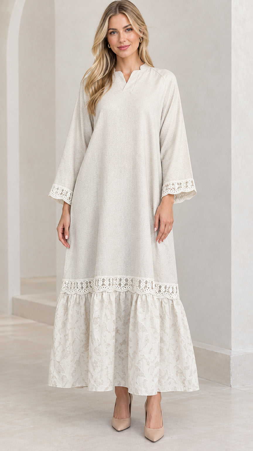 Front full-length view of woman wearing cream lace-trim long sleeve maxi dress