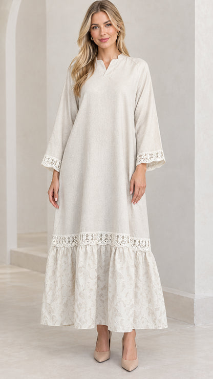 Front full-length view of woman wearing cream lace-trim long sleeve maxi dress