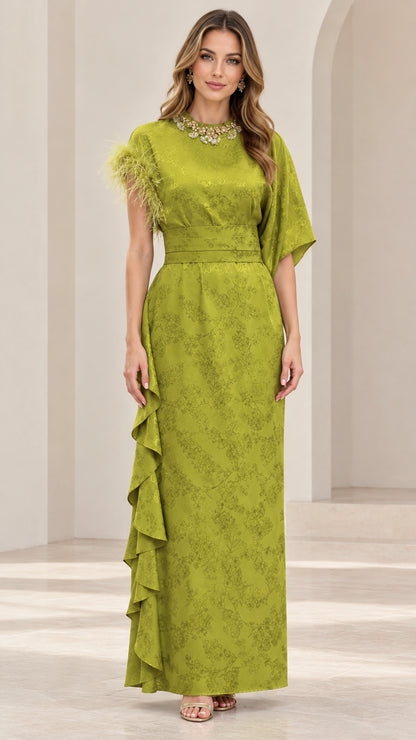 Front view of model wearing olive green embellished jacquard maxi dress with feather trim