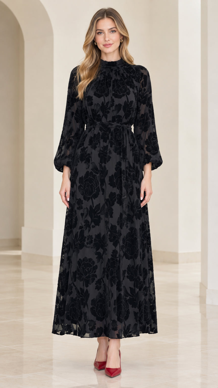Front view of model wearing black floral velvet burnout mock neck maxi dress