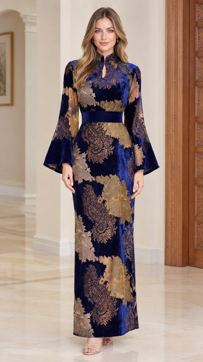Front full-length view of royal blue floral jacquard velvet maxi dress with bell sleeves