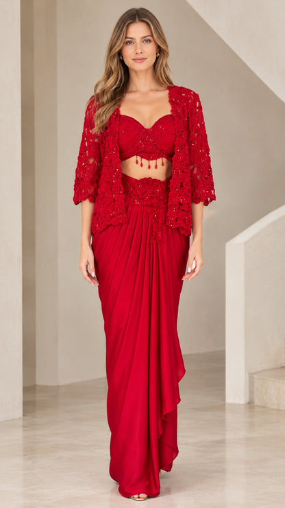 Front full view of woman wearing Red embellished 3-piece draped skirt set with lace jacket