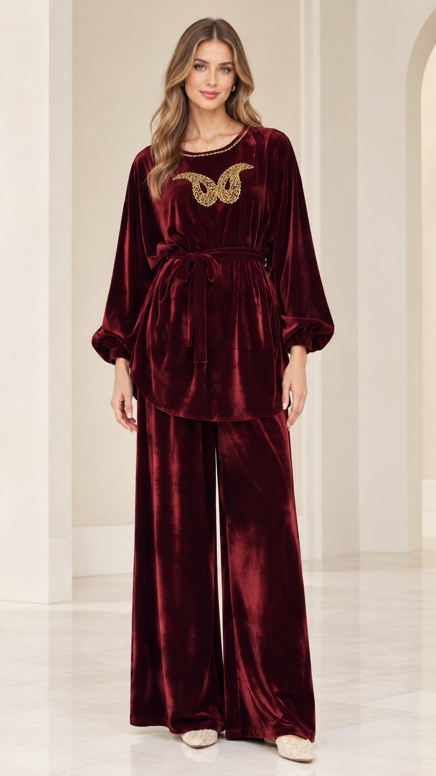 Front view of woman wearing burgundy velvet embellished tunic and wide leg pants set