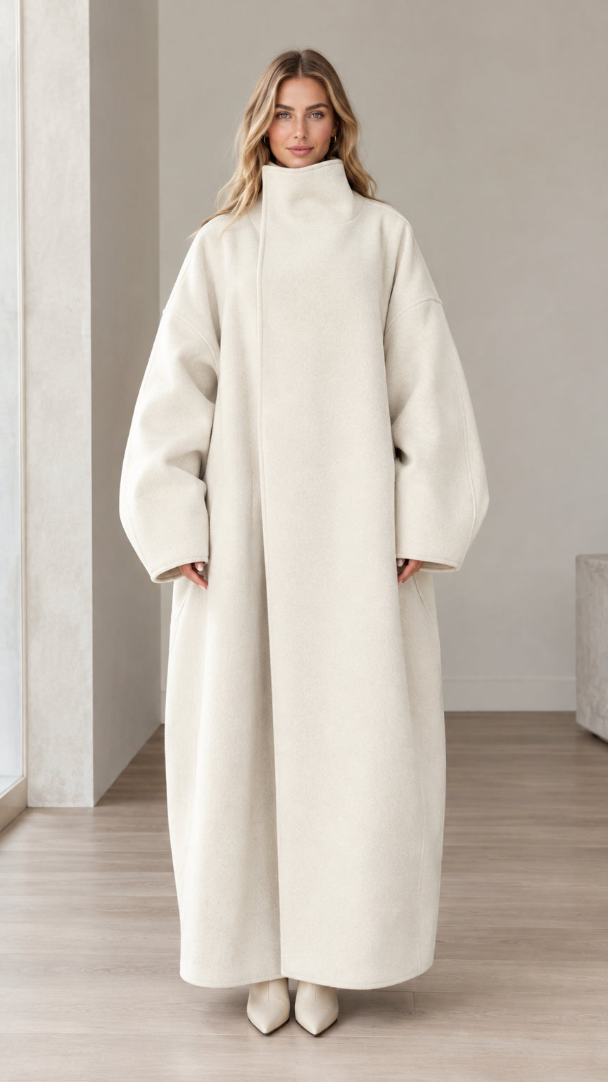 Front full view of woman wearing Cream high neck oversized maxi coat