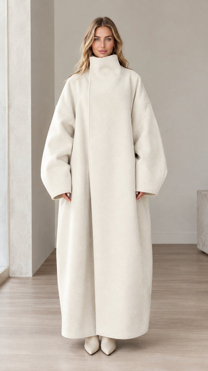 Front full view of woman wearing Cream high neck oversized maxi coat