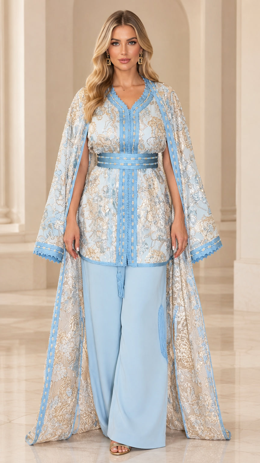 Front view of model wearing Light Blue embroidered jacquard cape, tunic, and pant set