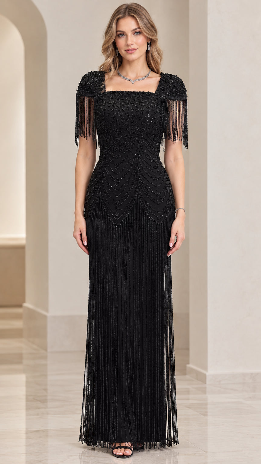 Front view of black beaded square neck evening gown with fringe details
