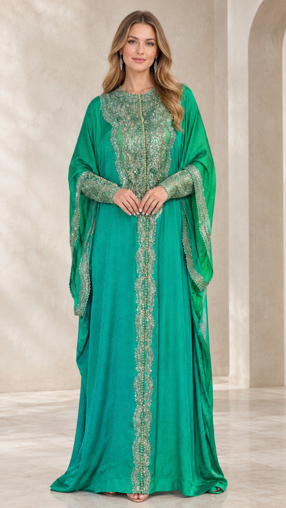 Front view of woman wearing emerald green embroidered cape sleeve kaftan maxi dress