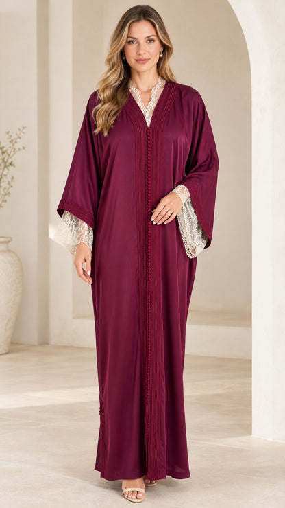 Burgundy long sleeve maxi abaya dress with lace cuffs and braided button placket front view