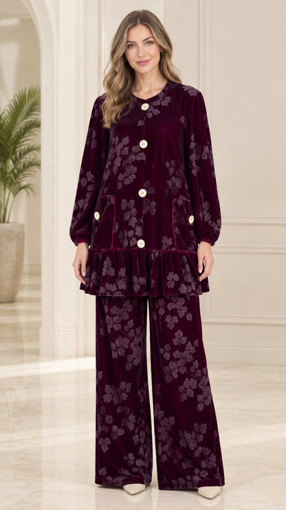 Front view of model wearing burgundy floral embossed velvet tunic top and matching wide leg pants set