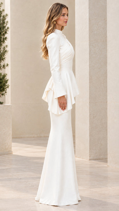 Side profile view of white long sleeve mermaid formal dress
