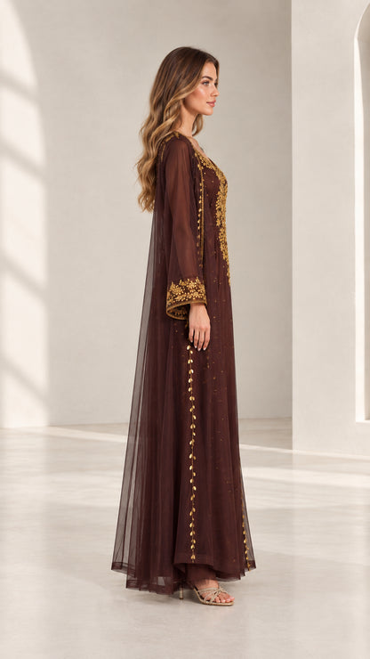 Side profile view of woman wearing chocolate brown embroidered kaftan maxi dress