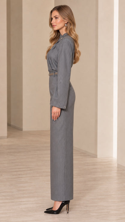 Side profile view of model wearing grey pinstripe maxi column dress